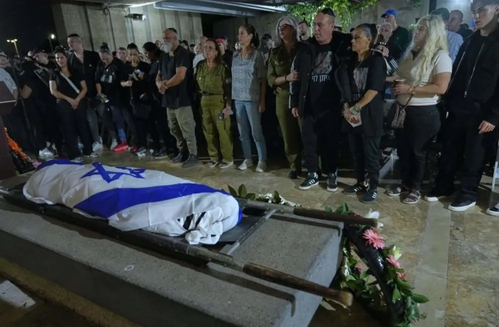 EL OBJETIVO FOTO GAZA ENTREGA DE CADAVER X